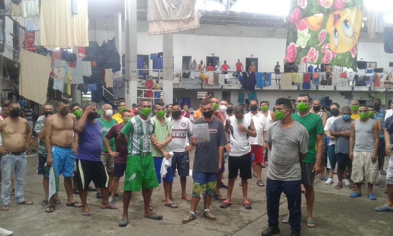 group of prisners in facemasks