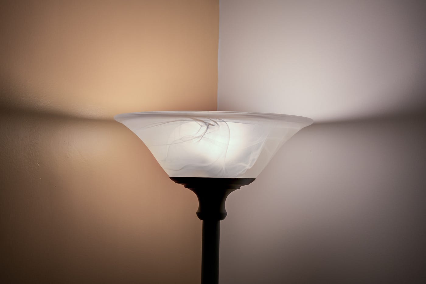 A lit torchière lamp.