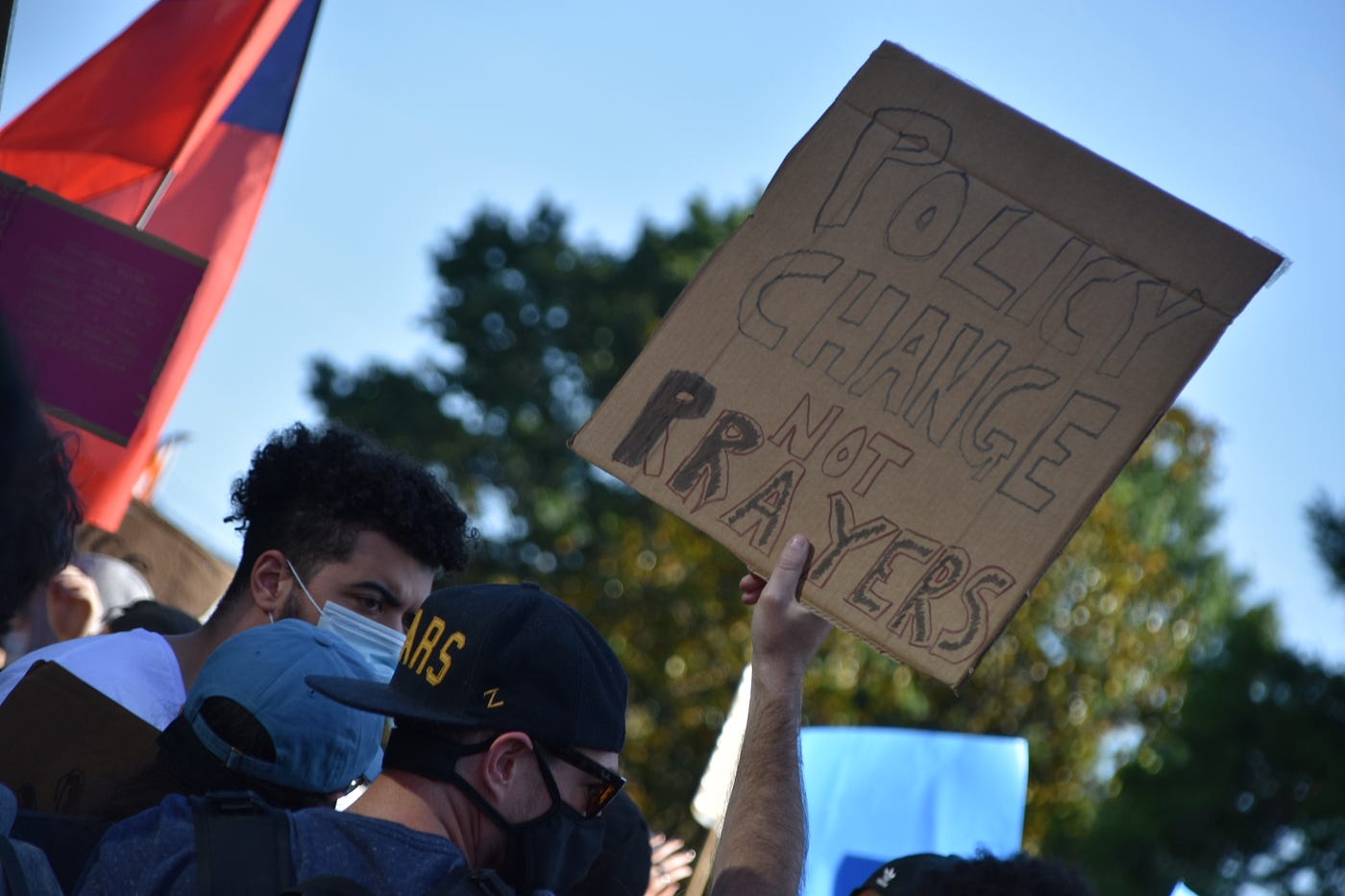 Protestors hold a sign outside of St. John Church in Washington, D.C.