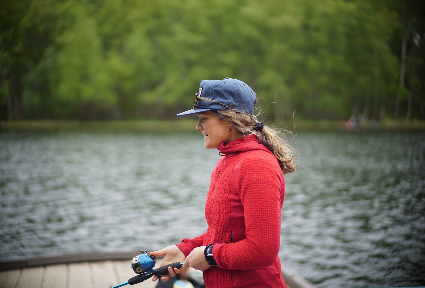 woman fishing on a dock