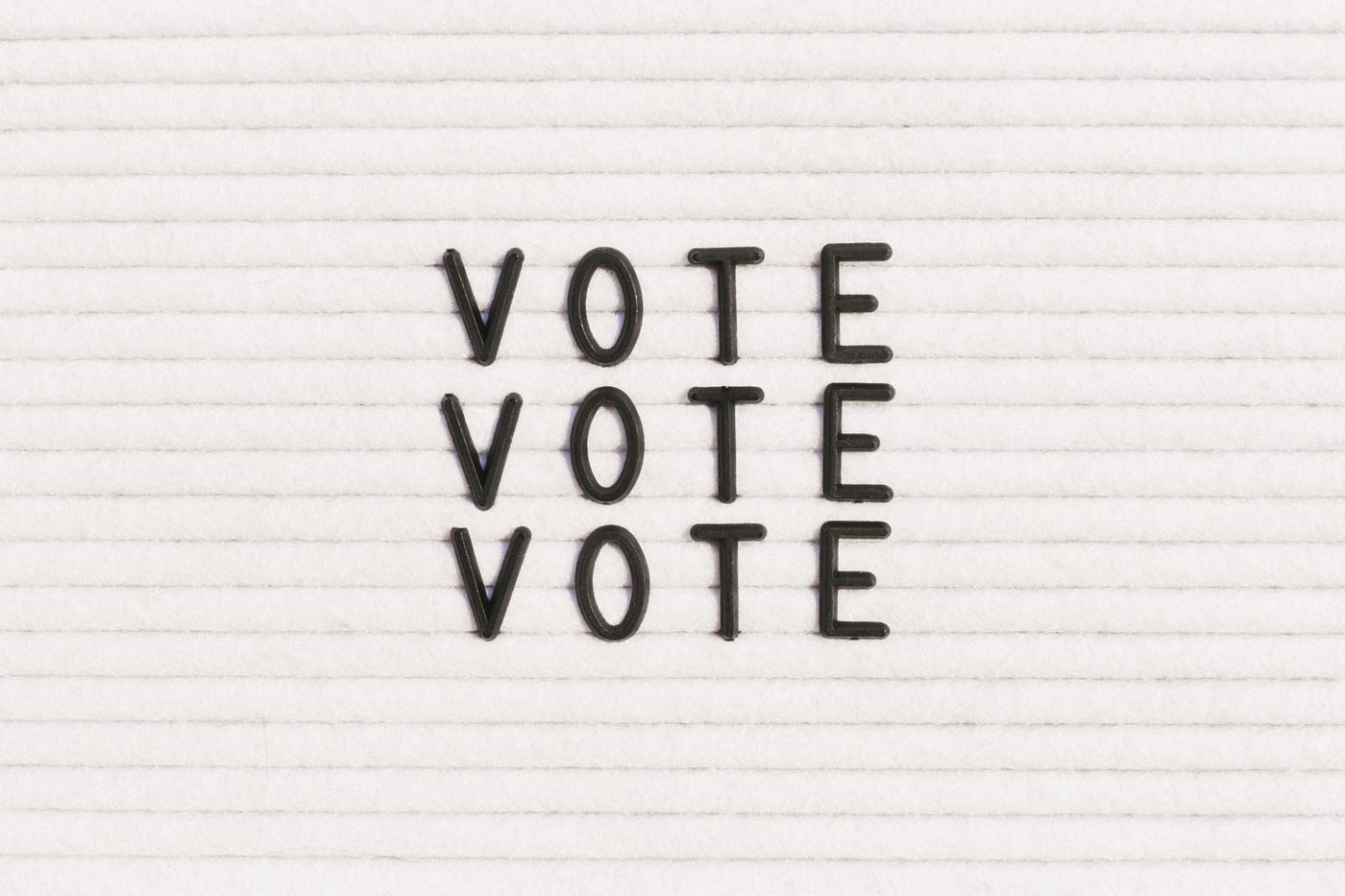 “Vote” written on a letter board.