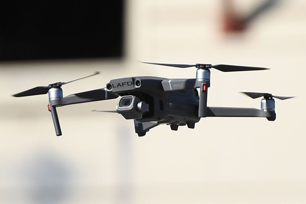 A photo of a drone in the air.