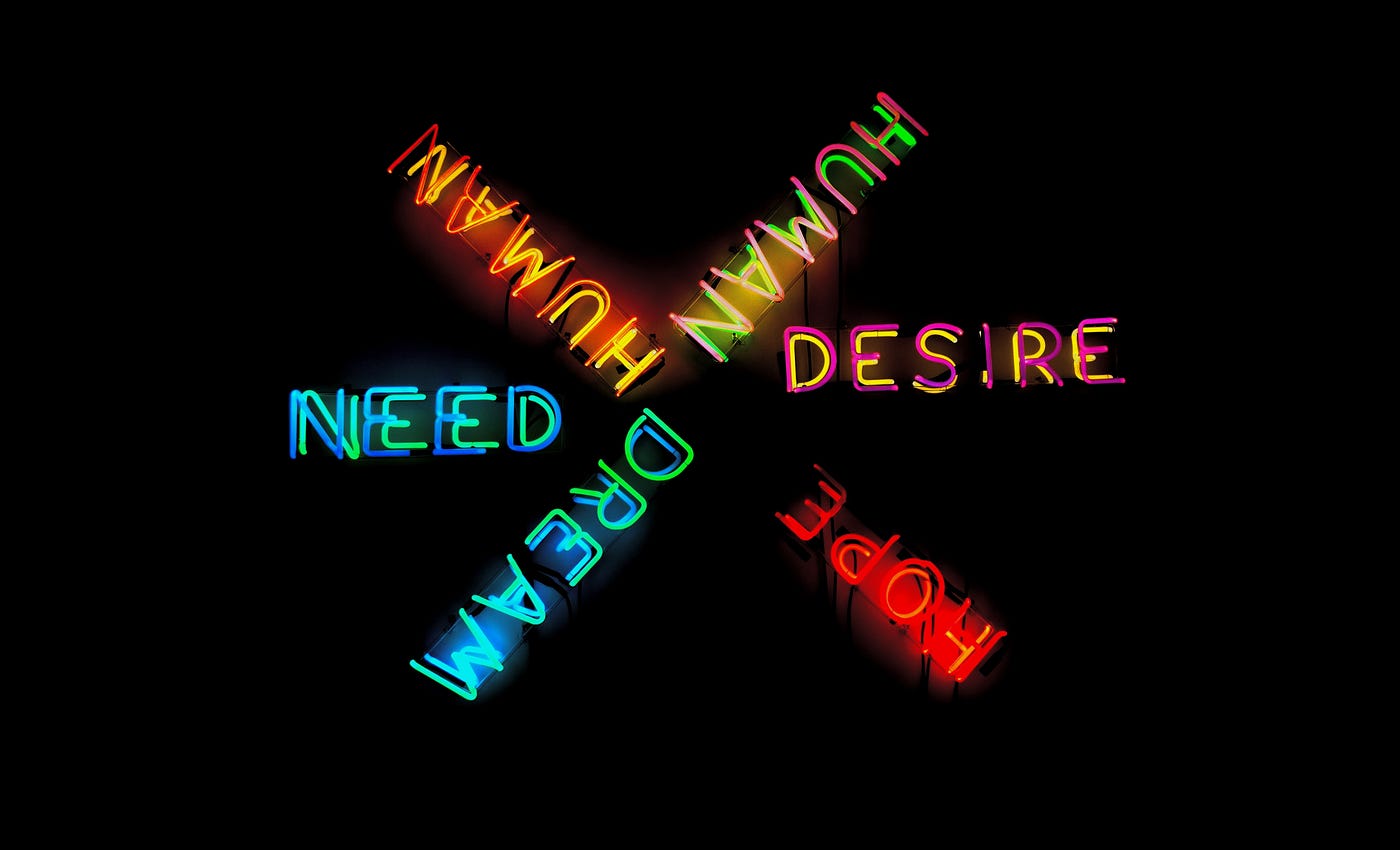 neon lights with conceptual words need dream desire hope human