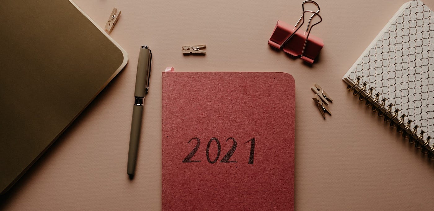 Desktop with 2021 journal and pen