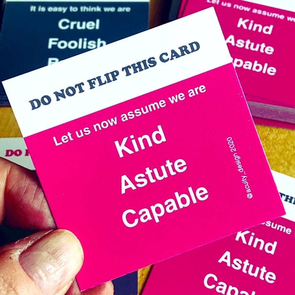 Square card held up — text says Do not flip this card. Let us now assume we are kind, astute and capable