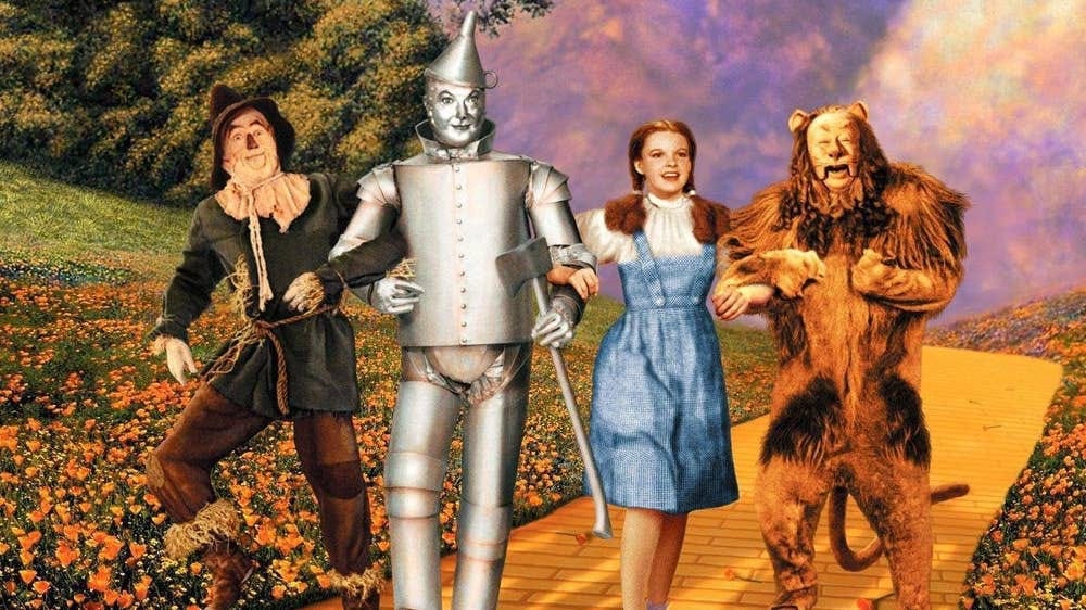 Image of Dorothy, Tin Woodman, Scarecrow, and Lion from 1939 Wizard of Oz film.