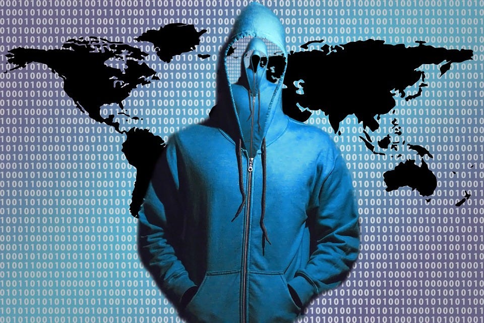 A cliched ‘Hacker in a Hoodie’ image; the inside the hoodie is another, smaller hacker in a hoodie, and inside that one is another.