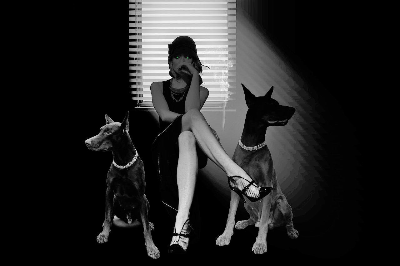 A striking woman sitting in a chair with a Dobermann dog either side