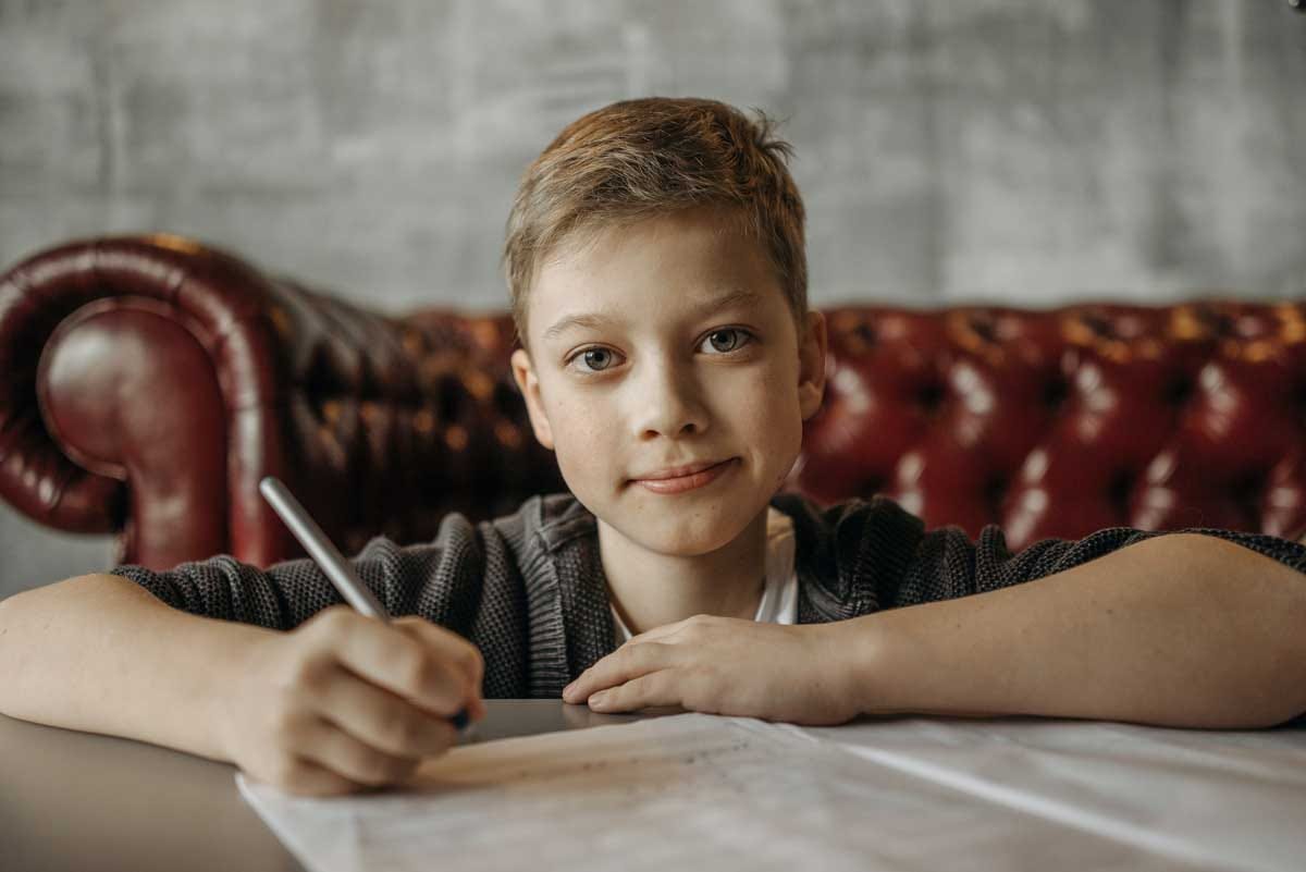 Young boy writing. Photo by Pavel Danilyuk.jpg