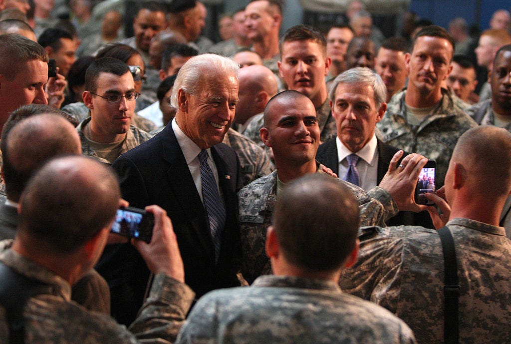 Then-VP Joe Biden visits Baghad’s Camp Victory in 2011 to greet U.S. soldiers