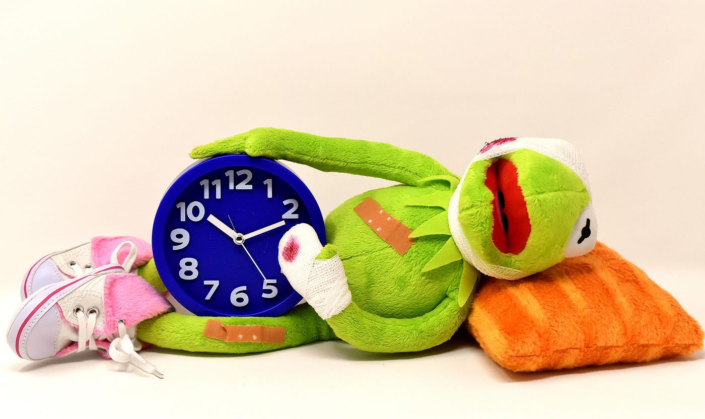 stuffed toy frog with injuries