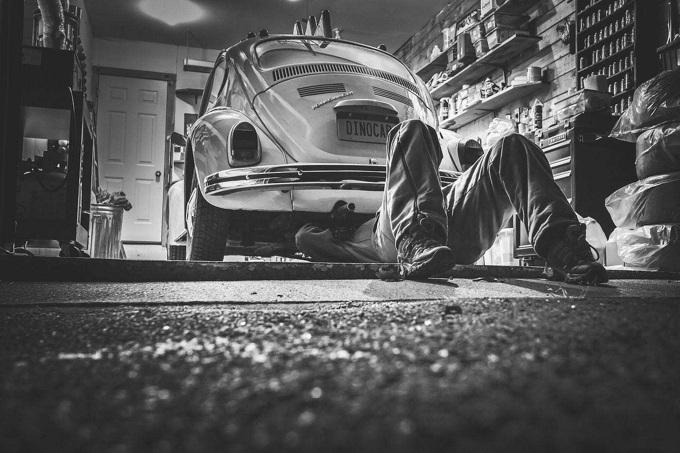 Man tuning his car, representing model optimization.