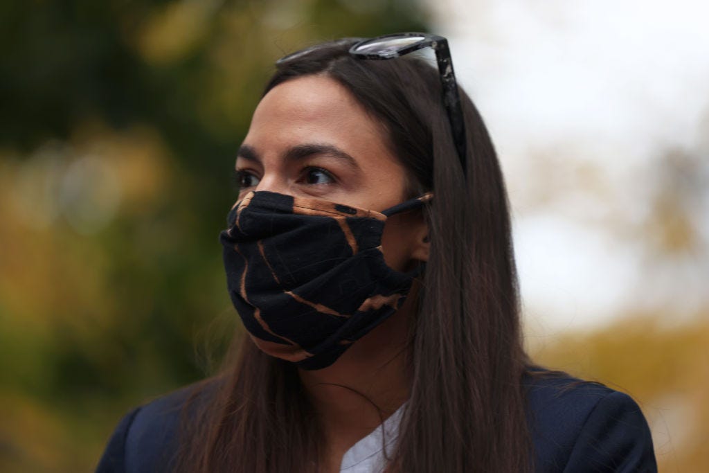 Alexandria Ocasio-Cortez wearing a face mask.