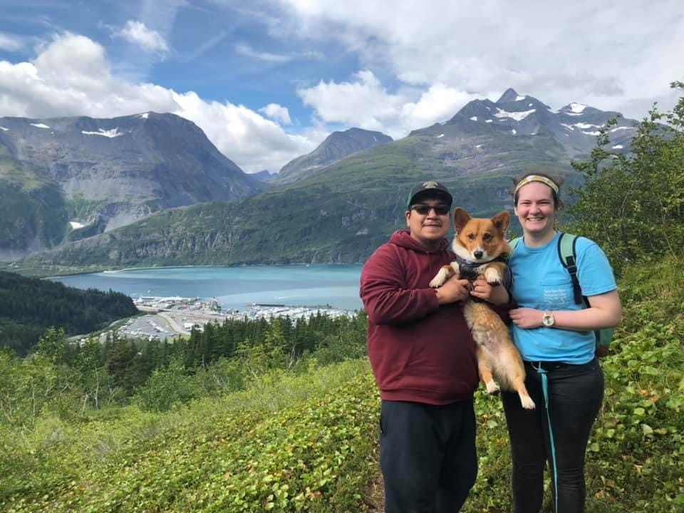 Christine with her husband and corgi, Winston!