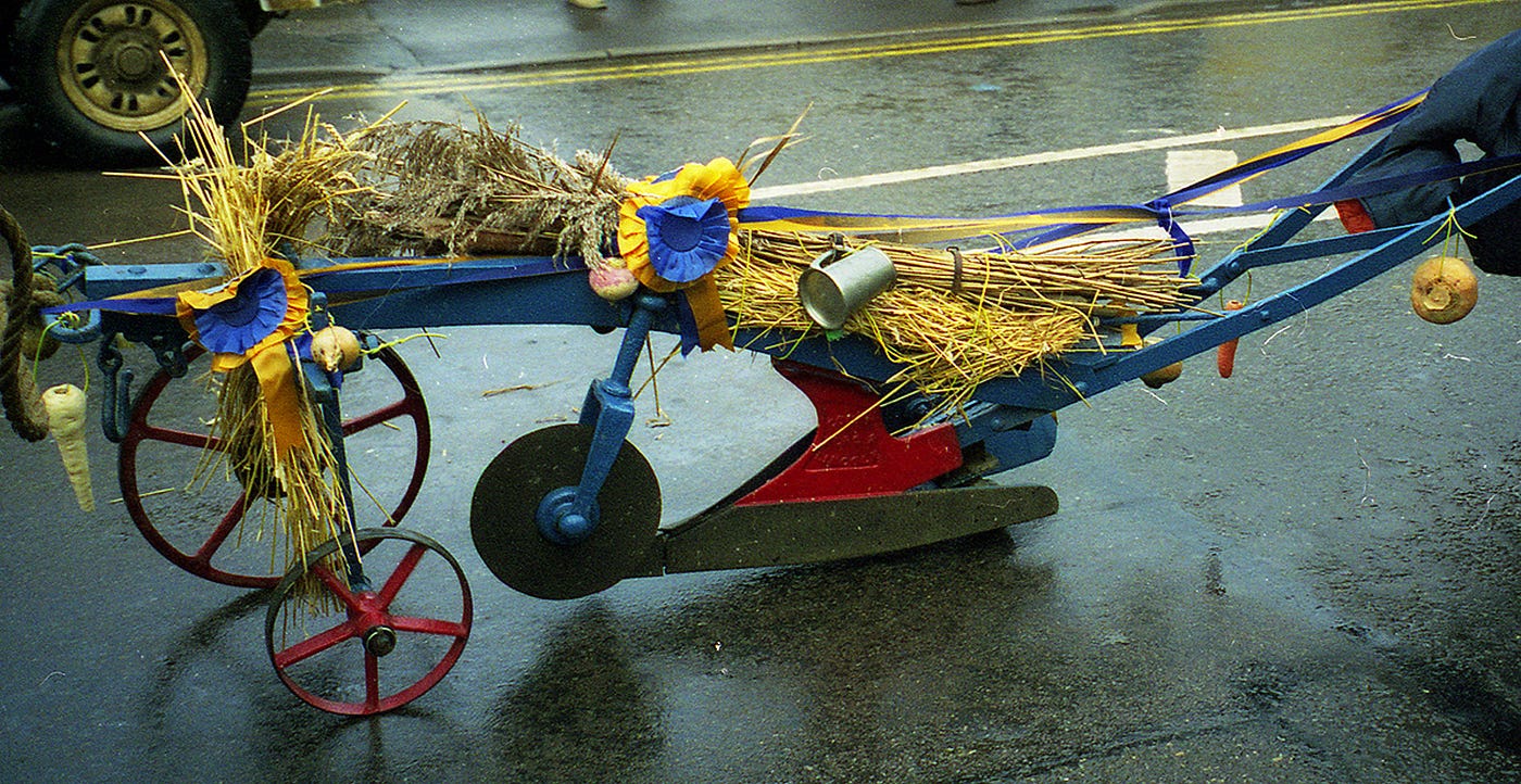Image of a decorated plough being pulled through the streets of Whittlesey, Cambridgeshire, UK at a folk festival