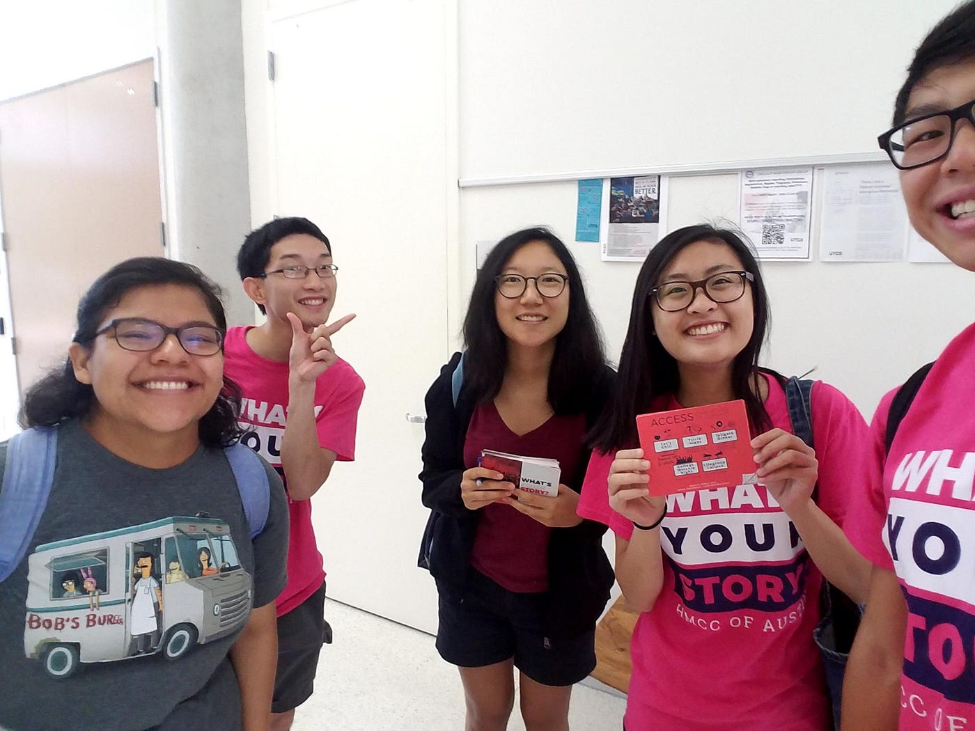 several people wearing pink shirts for outreach