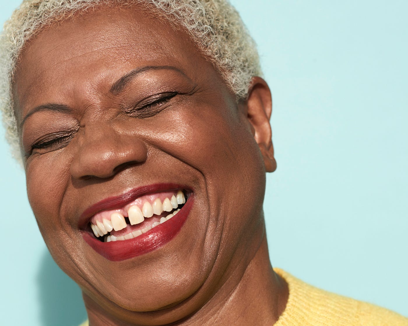 Closeup of a woman’s smiling face.