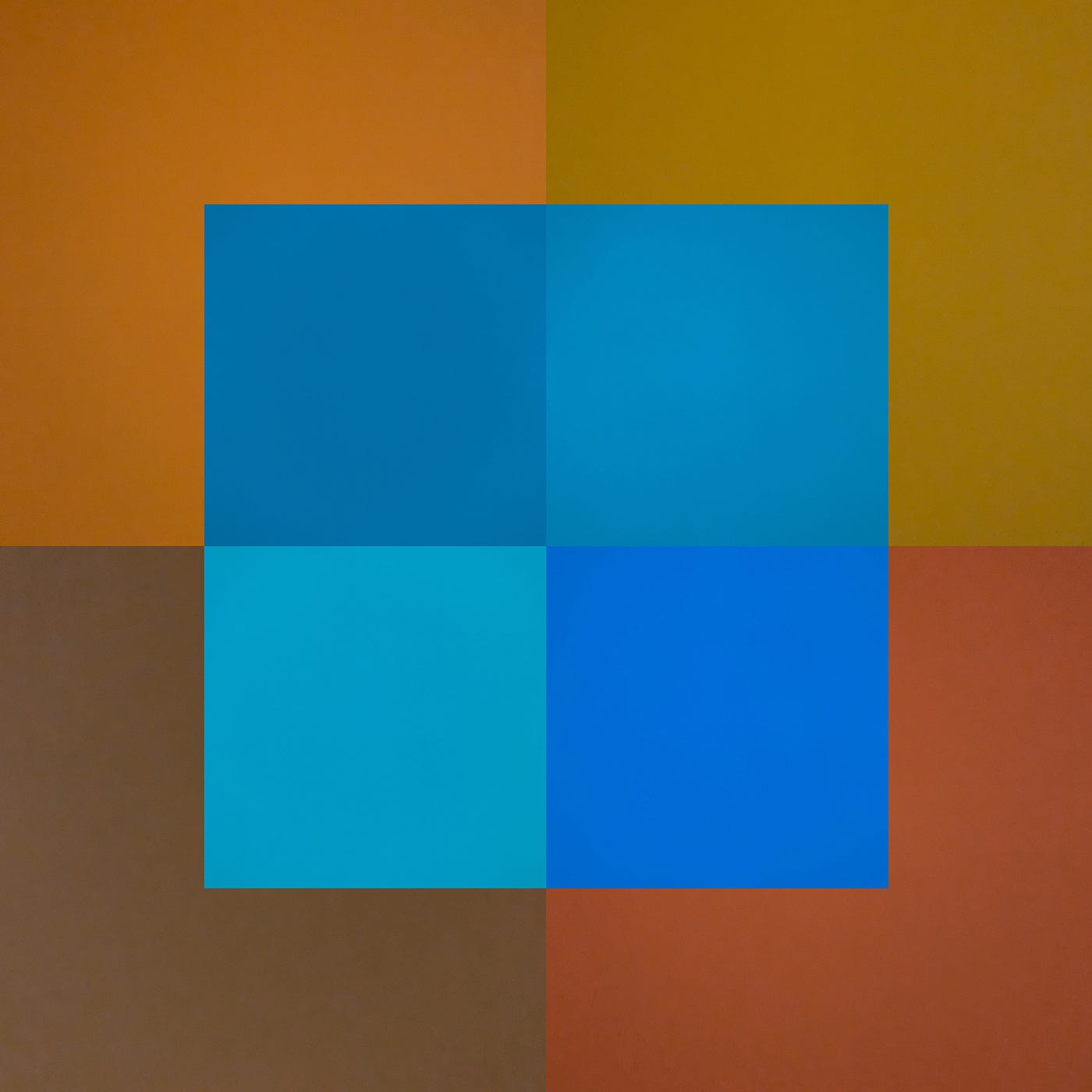Color blocks layered on top of each other. Shades of blue hovering over warm earth tones.