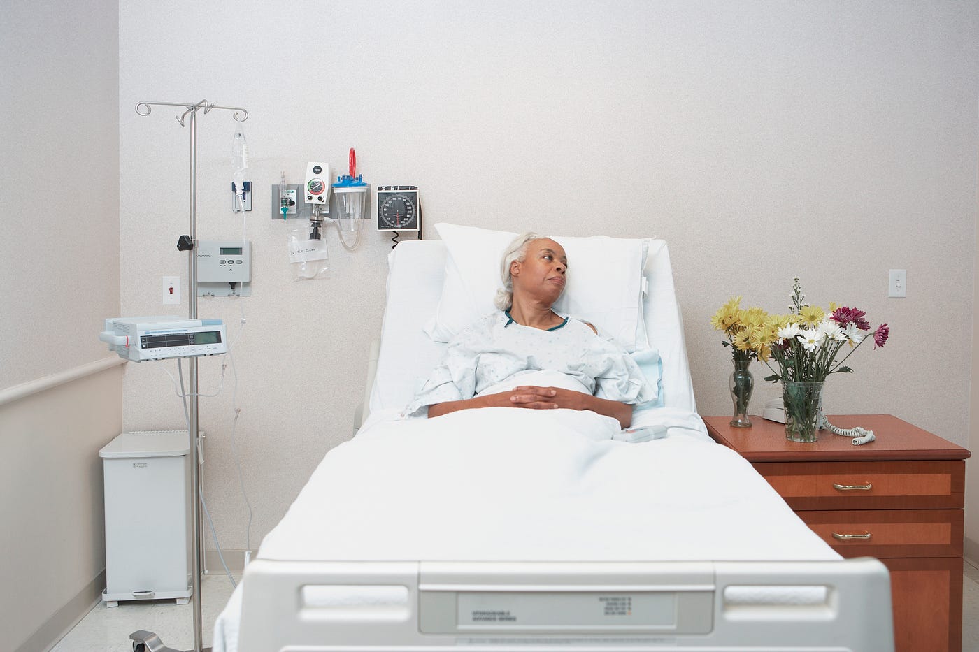 An elderly Black woman as a patient at the hospital.