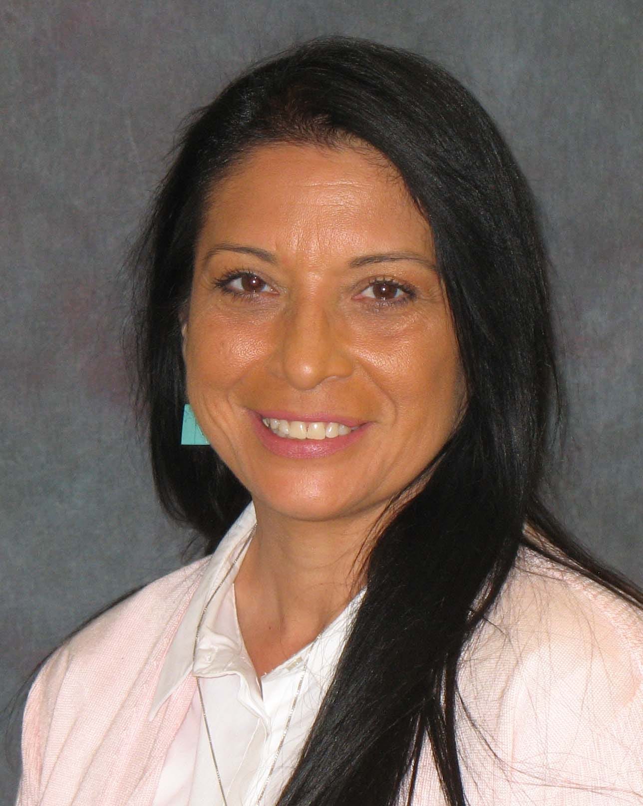 Sarita McGowan smiling for a posed portrait