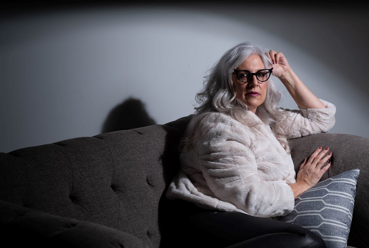 Photo of woman in her 60s with pensive look