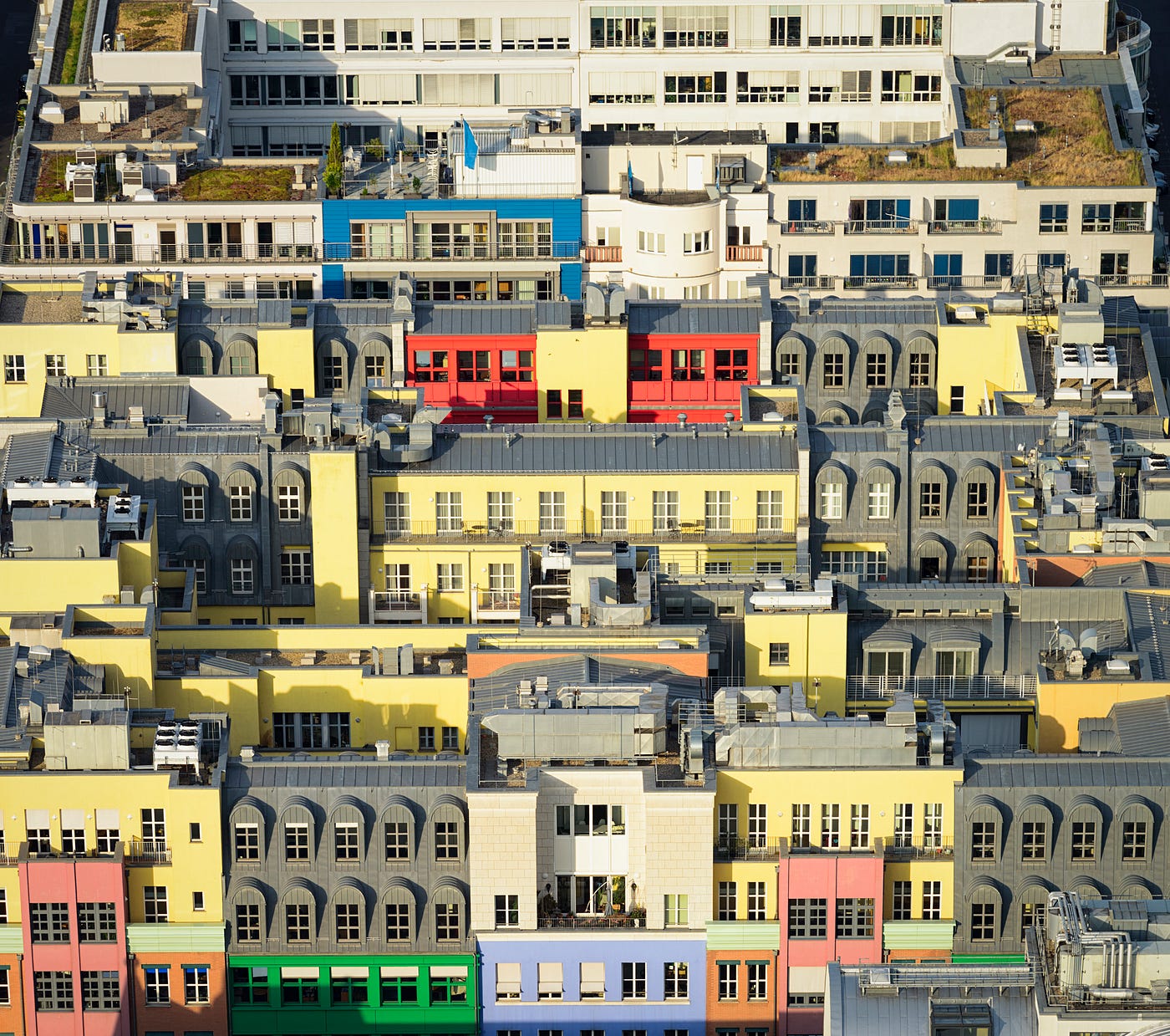 An aerial view of residential and office buildings on a city block in Berlin, Germany.