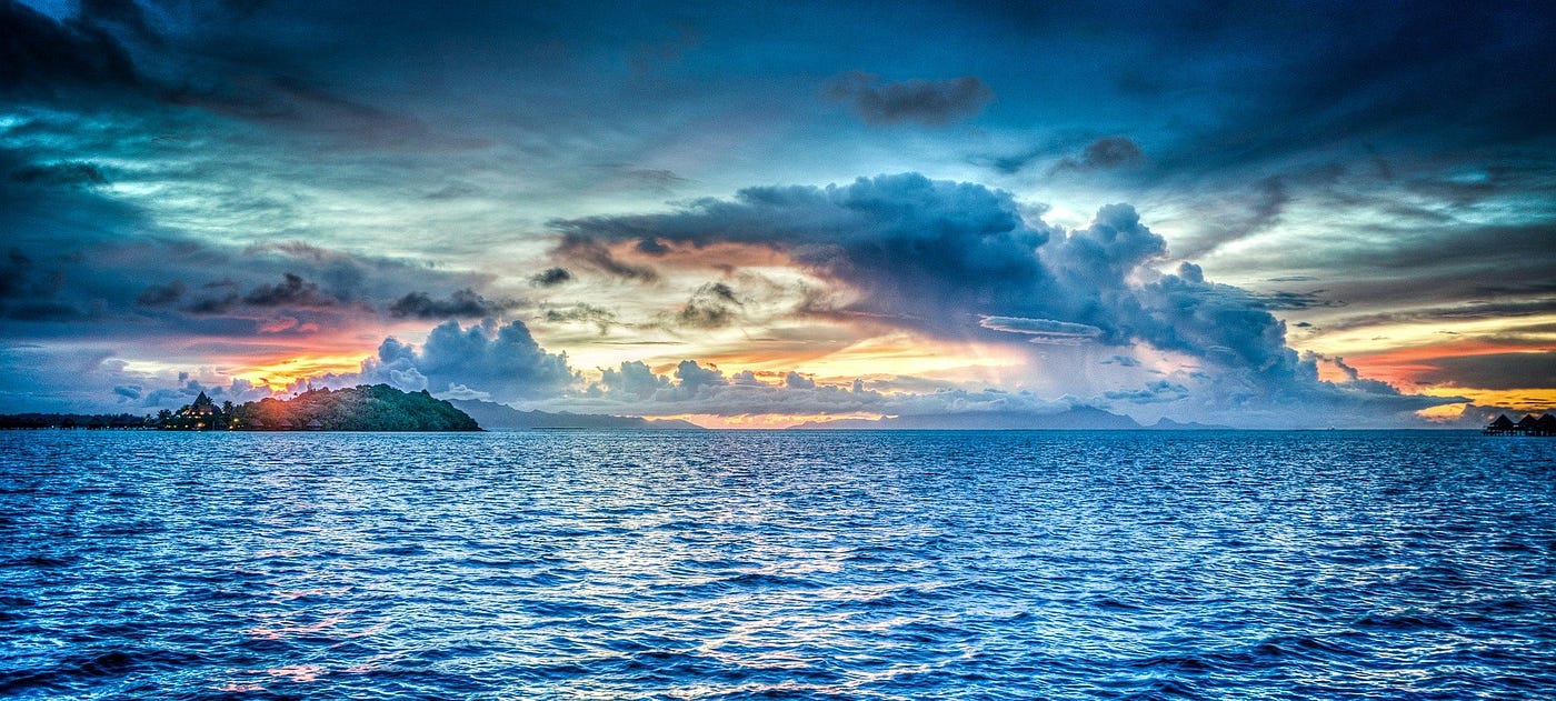 Image of blue sea with sun rays