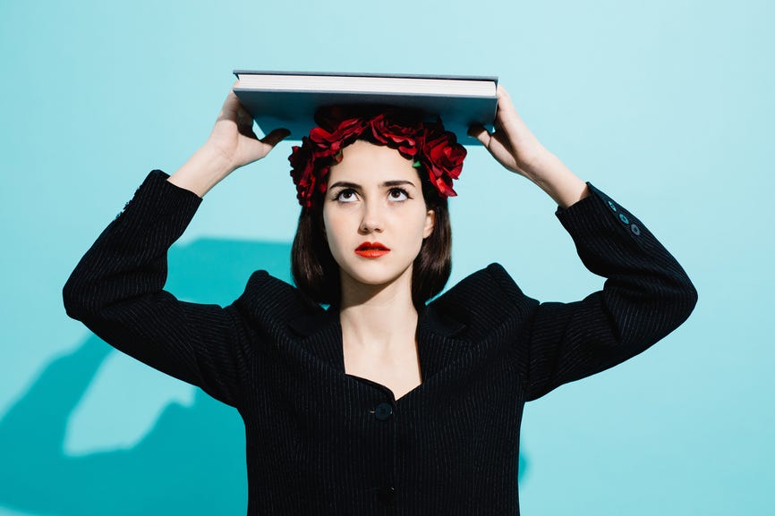 Woman looking at her book.