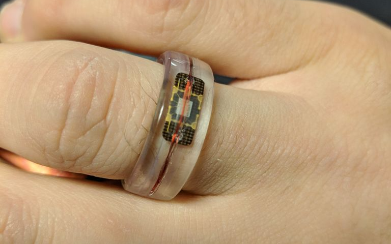 This wire was then soldered to the and wrapped inside of a 3D-printed ring ...