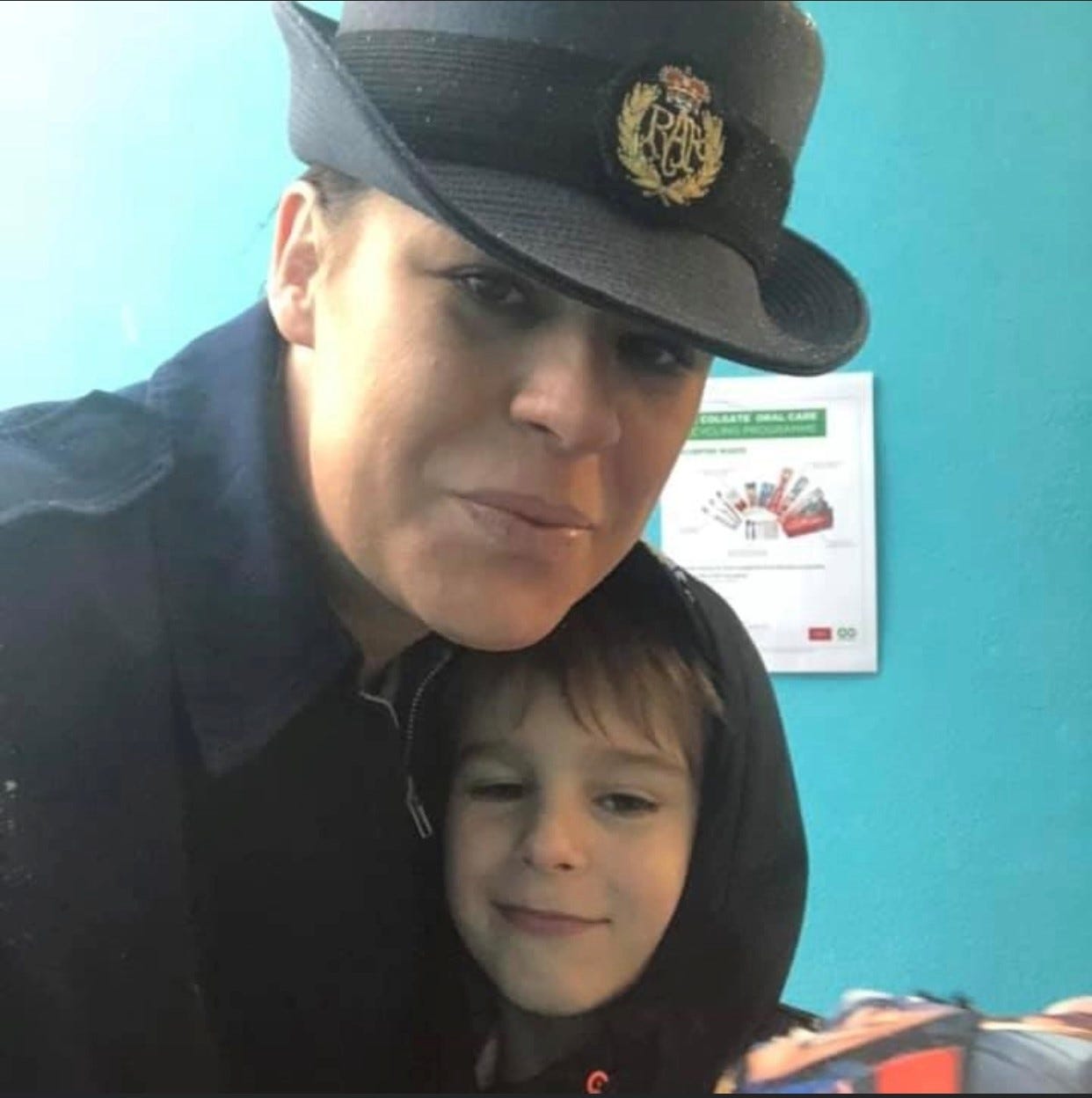 Cpl Vicki in her RRAF uniform and hat, takes a selfie with her youngest son.