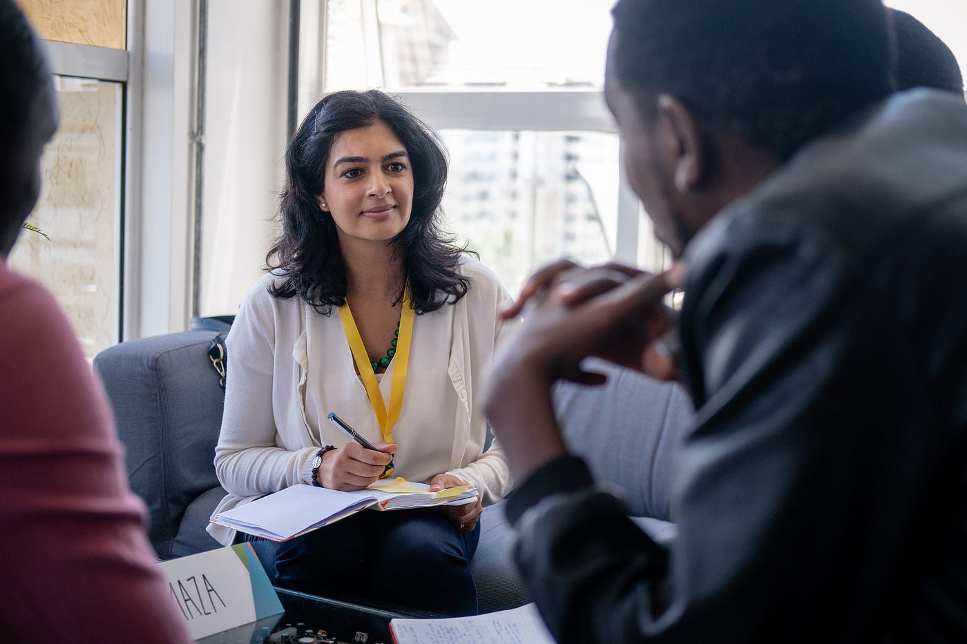 An employer and member of The ROOM interviewing ALX learners