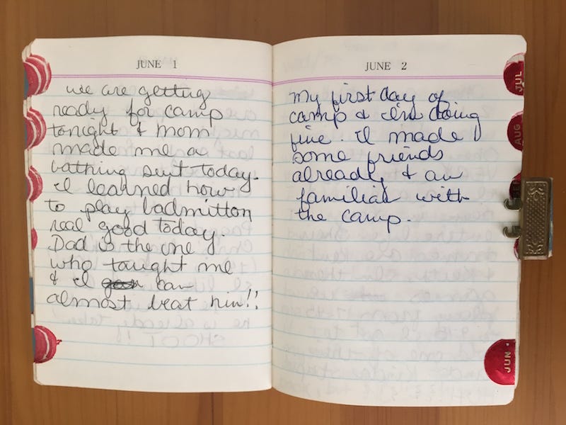 Open diary book with June 1 and June 2 at top and girlish handwriting on the lined pages