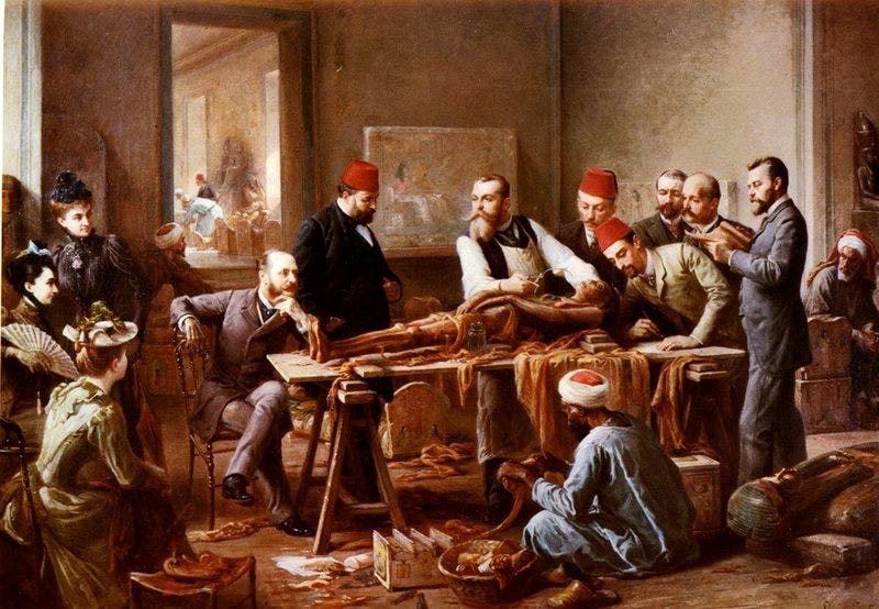 Painting of mummified body being examined by a group of men. Some are wearing red fez hats. A crowd of women are watching the examination.