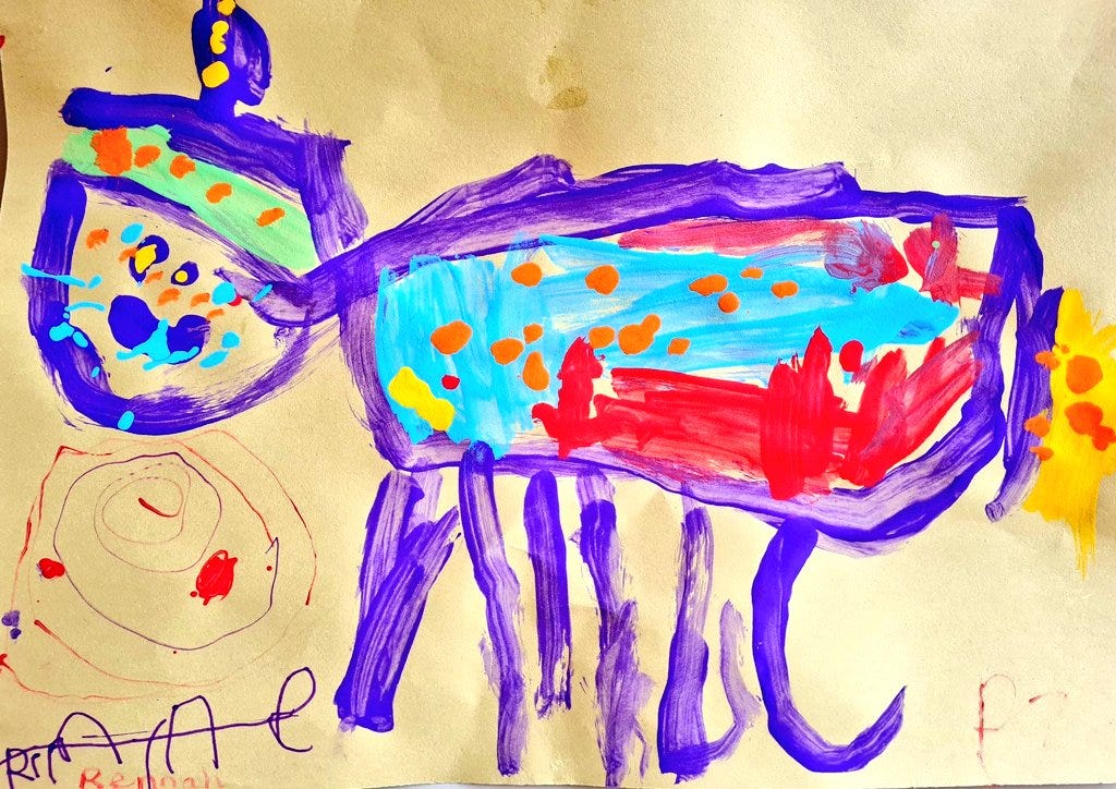 A brightly coloured picture of a unicorn. Done my a 3 year old with paint. Mostly purple, with red wings and a blue body