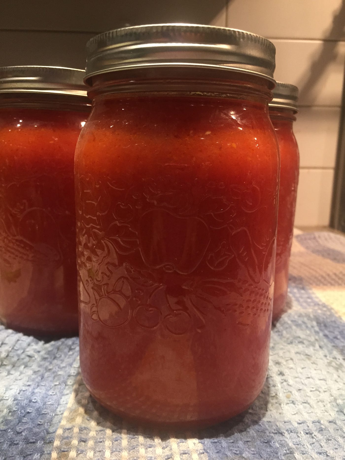 Turning a bushel of tomatoes into beautiful sauce! by Mark