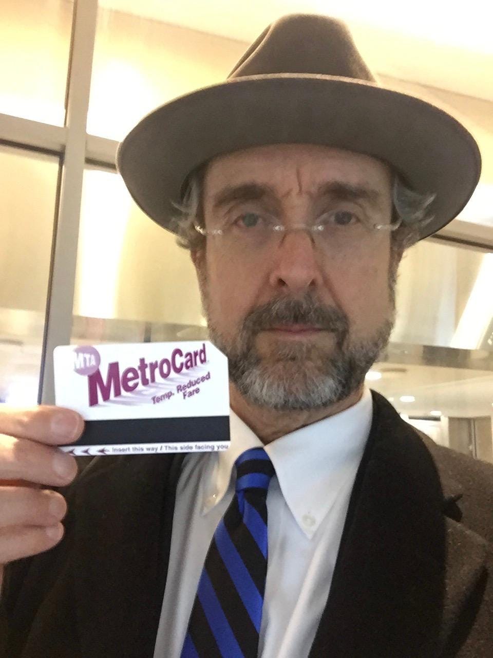 The author approaching 66, with his senior discount subway fare card.