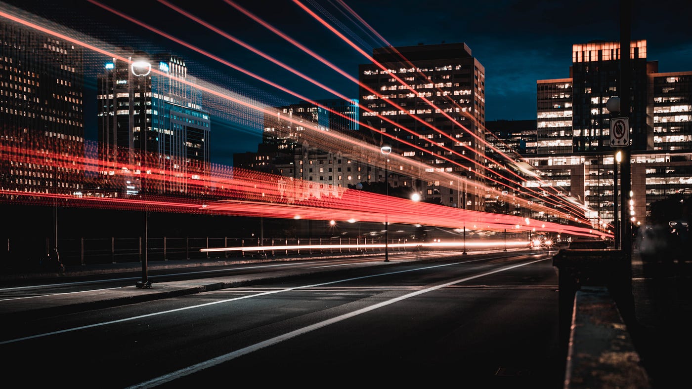 A picture of a city taken with a low-speed shutter representing the fast and furious movement of urban dynamic