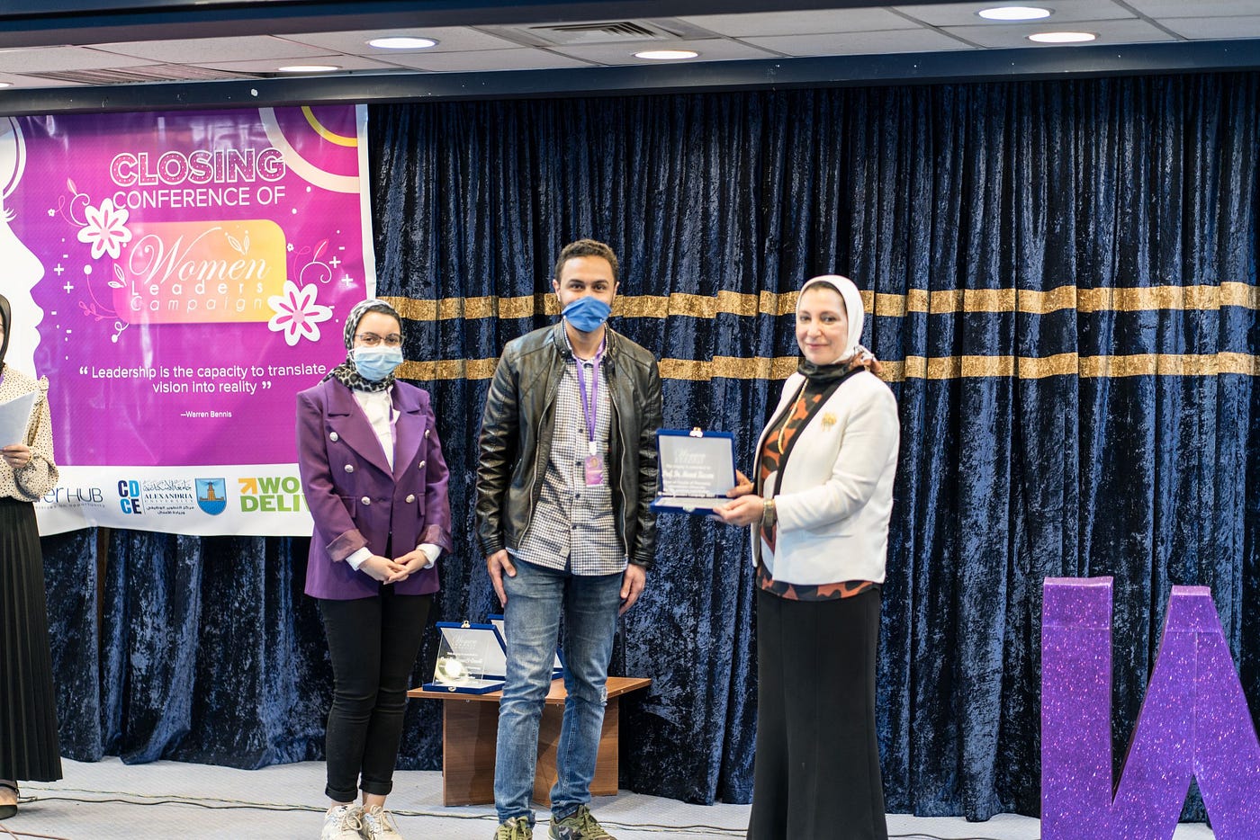 Amr Hassan accepting an award for his advocacy work at the closing conference of the Women Leaders Campaign in Egypt.
