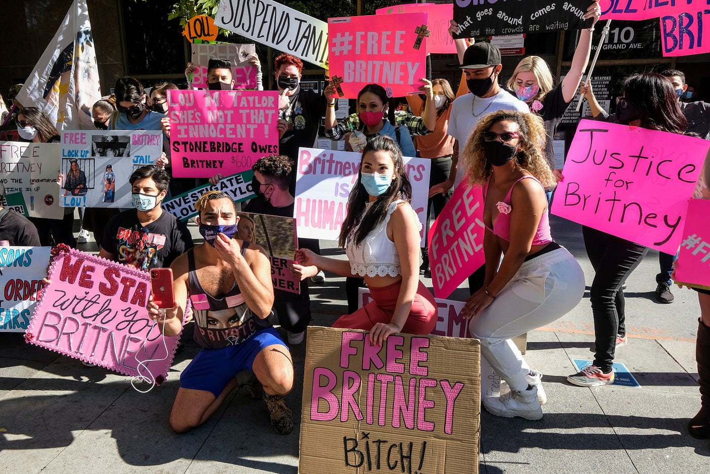 #FreeBritney protesters. Their signs are very pink.