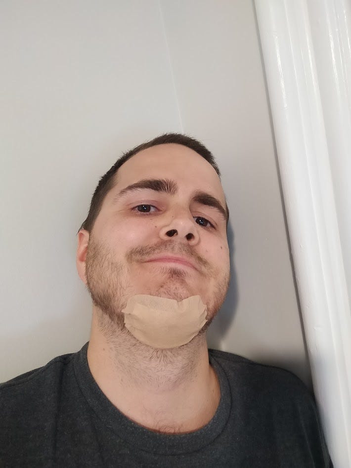 My face with a bandage over my chin