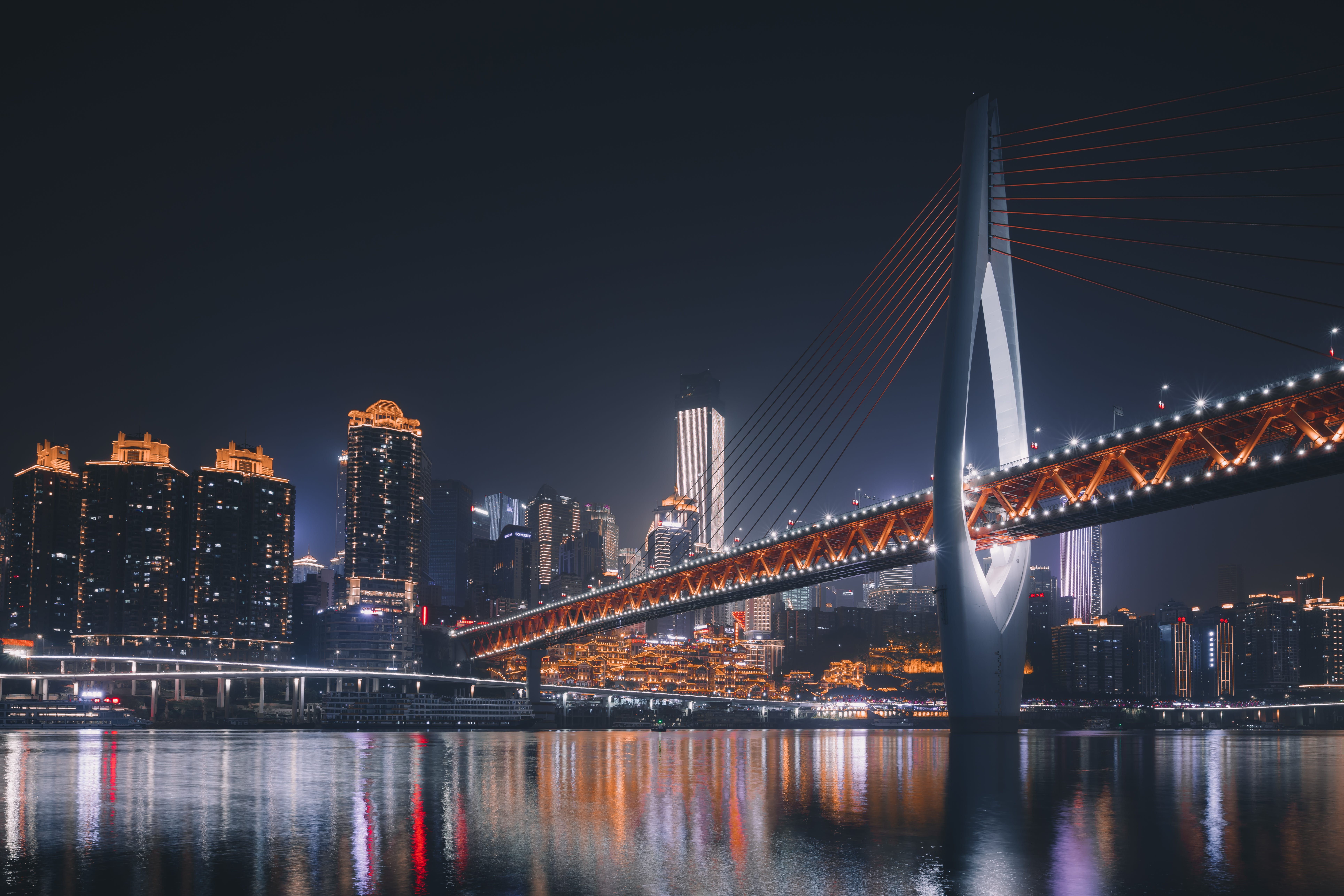 A night picture of a large, lighted bridge in China