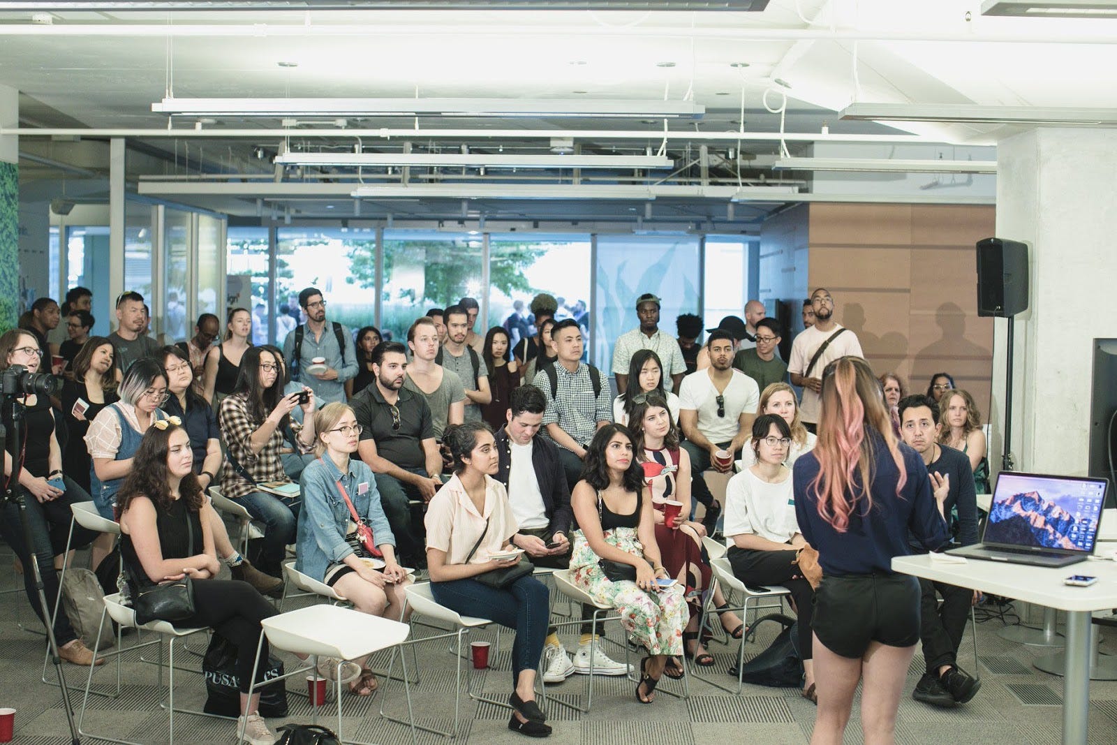 Speaking at a UX lightning talk, room of people.