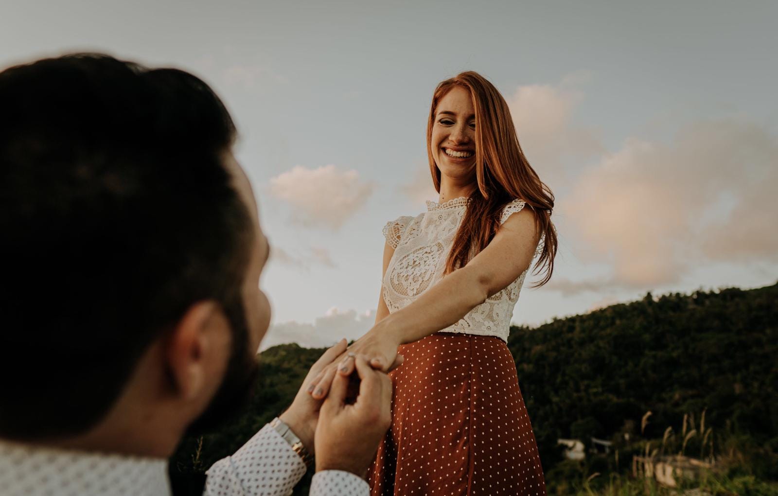 Newly engaged couple in the mountains.