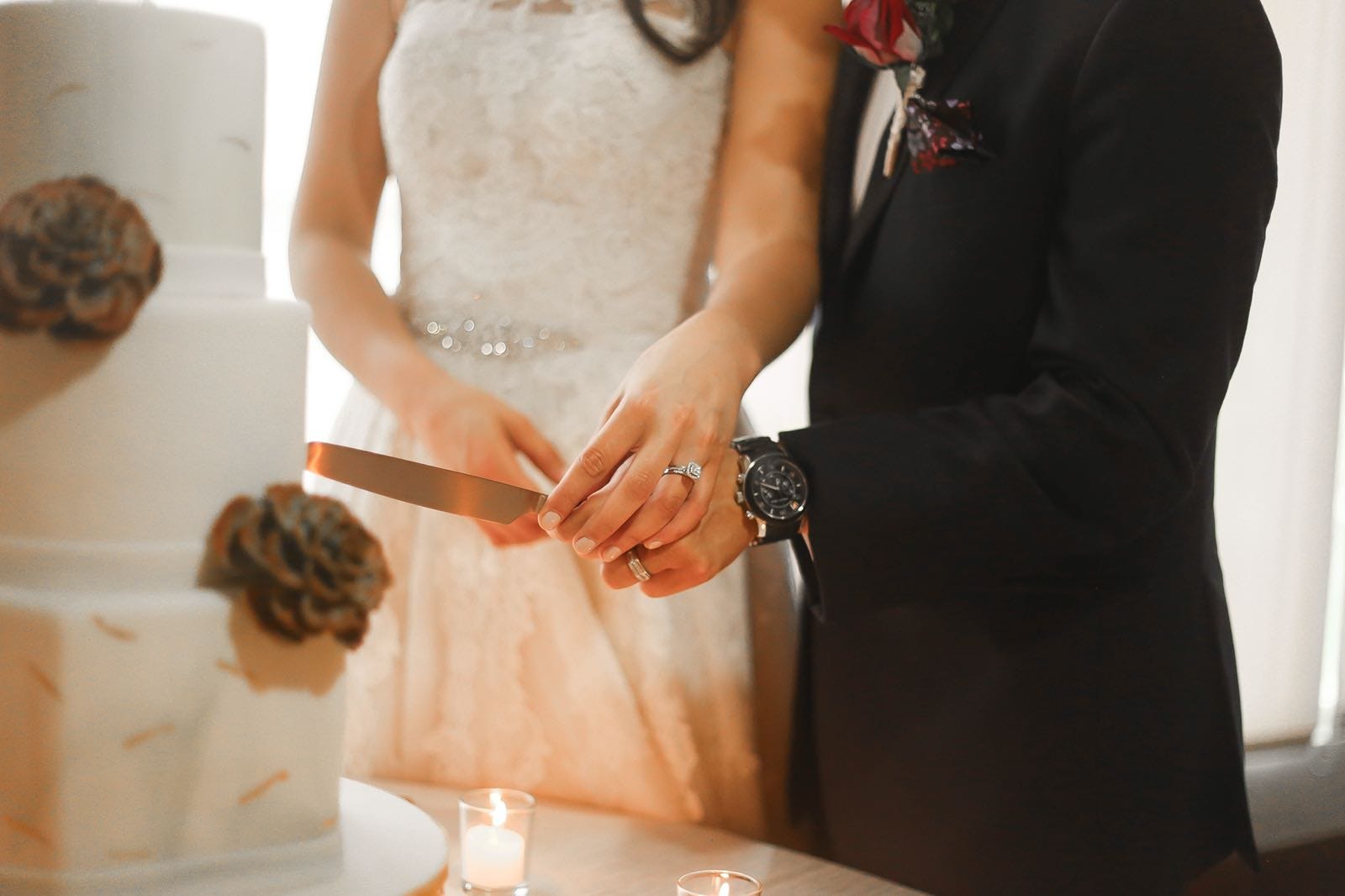 Bride and groom cutting their wedding cake