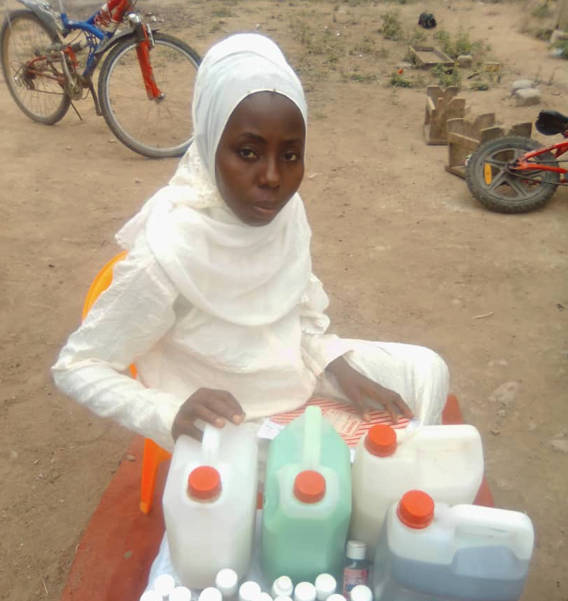 Sakina Ansah of Central Region, Ghana, showing her hand sanitiser and other detergent products, which are used in local hospitals.