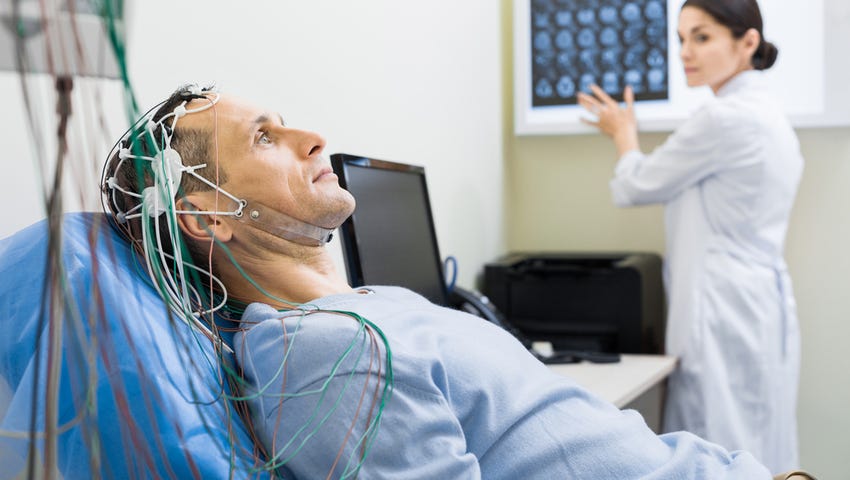 An EEG records electrical brain activity as it happens