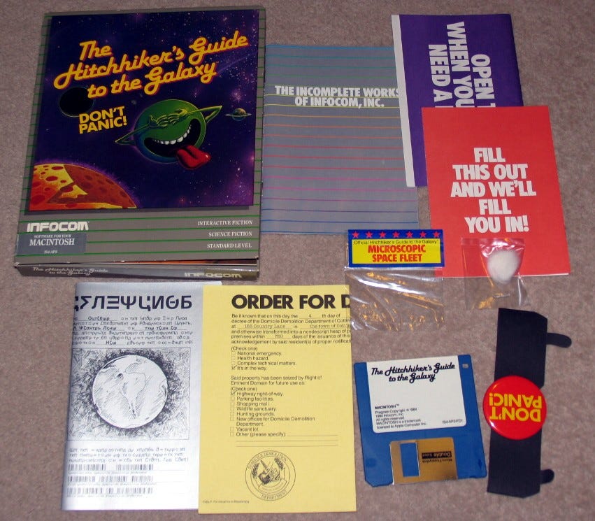 The contents of Infocom’s Hitchhiker’s Guide game, including a microscopic space fleet and Don’t Panic button.