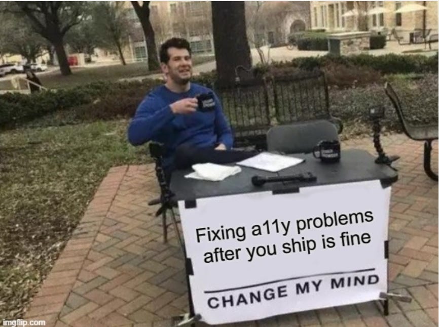 The NYC “Change my mind” guy at a table drinking coffee with a sign that says “Fixing a11y problems after you ship is fine”