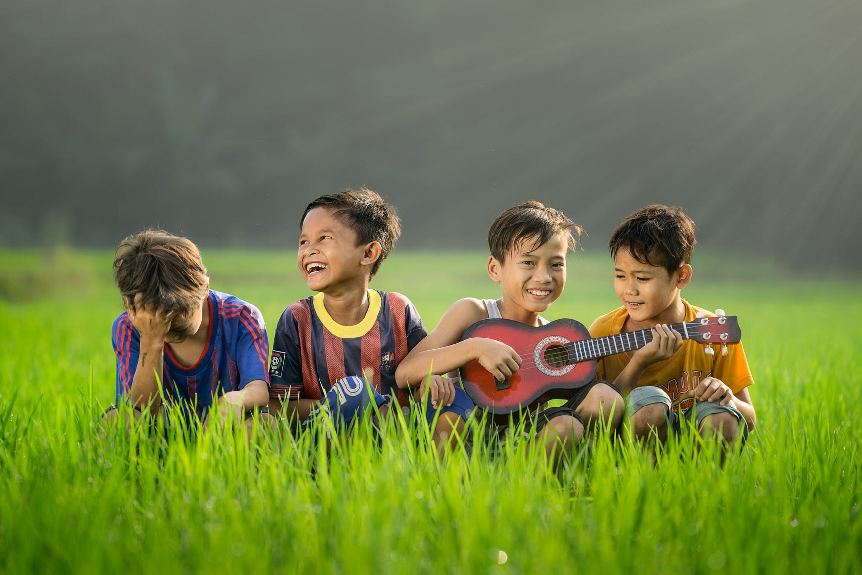 Little boys having fun and playing music.