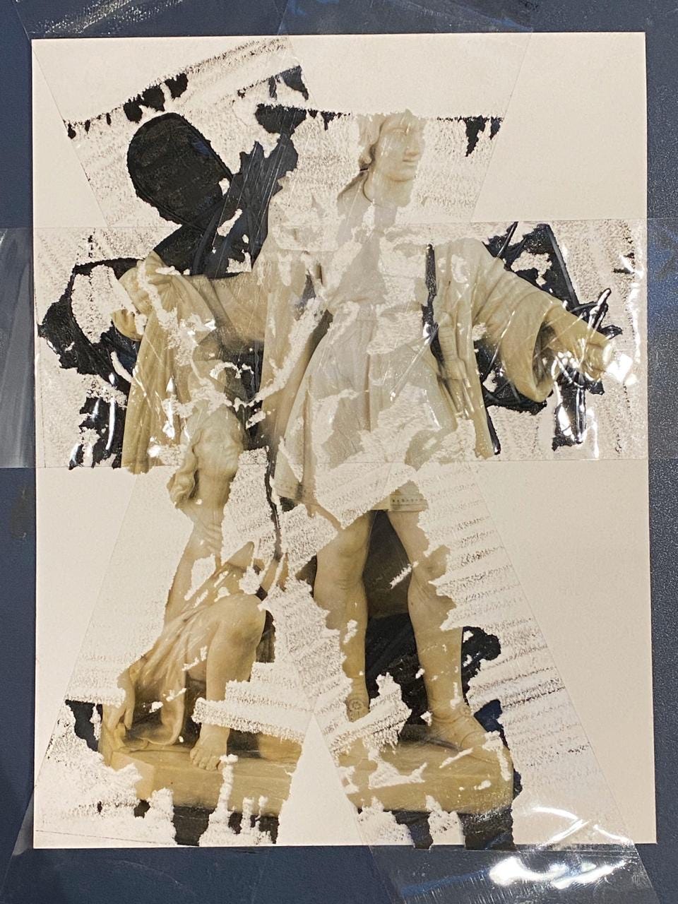 An image of a marble sculpture appears distorted and torn from a tape transfer process.